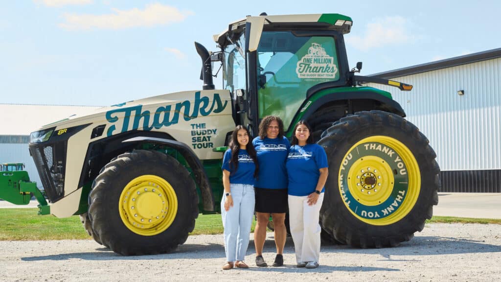 Fields of Promise fellows header in front of One Million Thanks Tractor